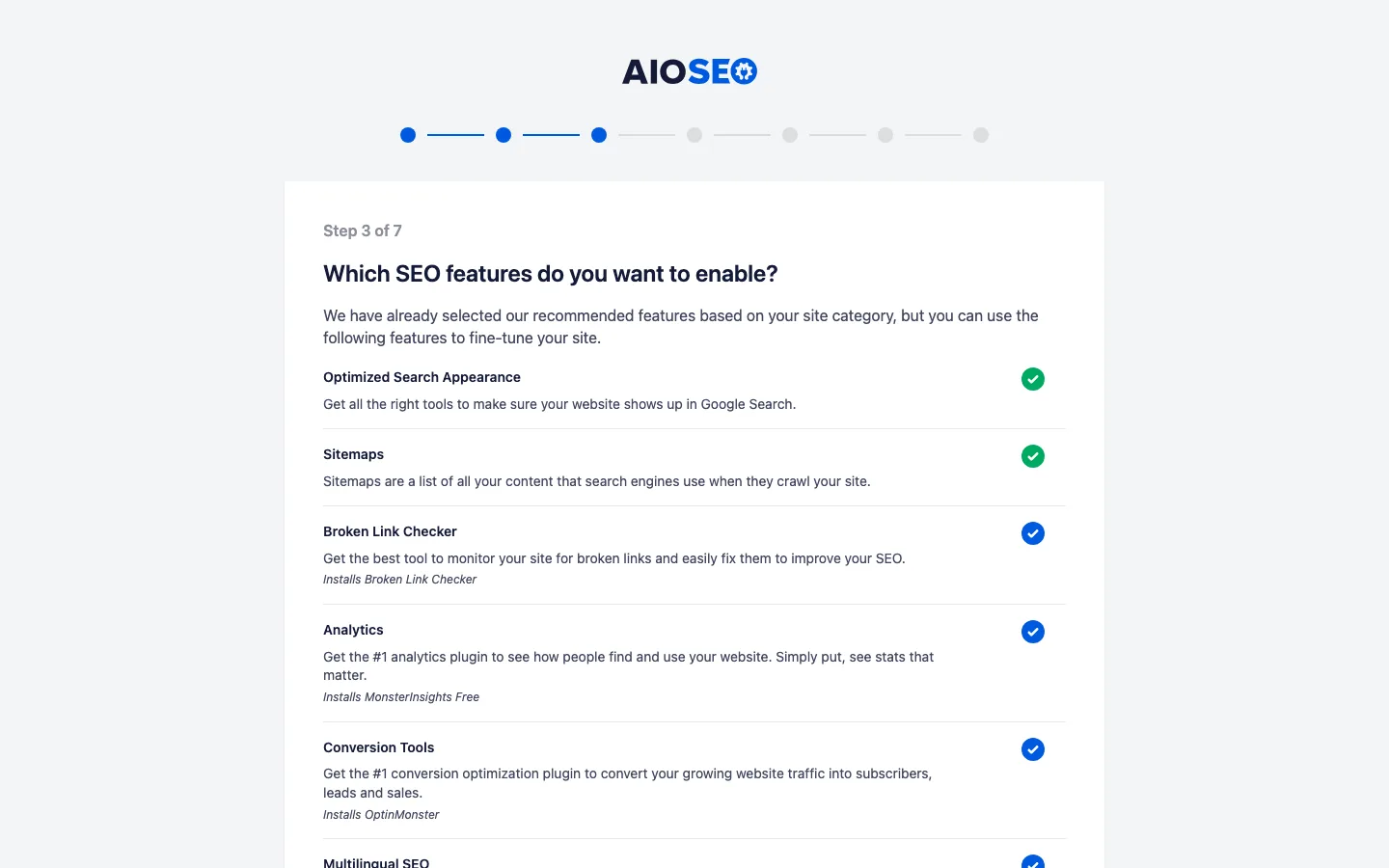 AIOSEO setup wizard step 3 with Broken Link Checker, MonsterInsights and OptinMonster installs ticked by default