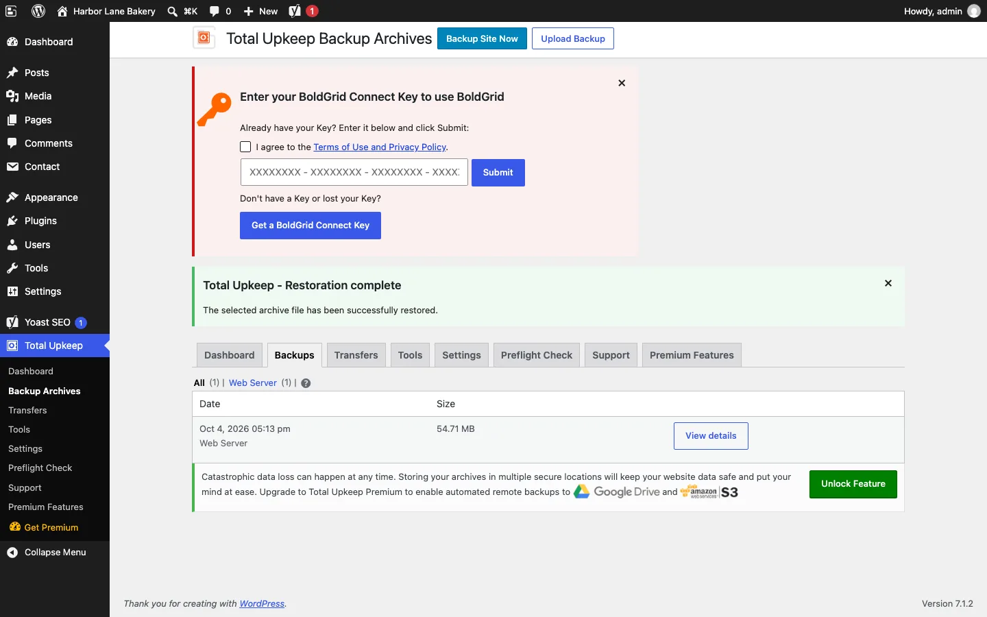 Total Upkeep Backup Archives page with a BoldGrid Connect Key prompt, a green “Total Upkeep - Restoration complete” notice, one 54.71 MB backup, and an upsell for remote backups to Google Drive and Amazon S3