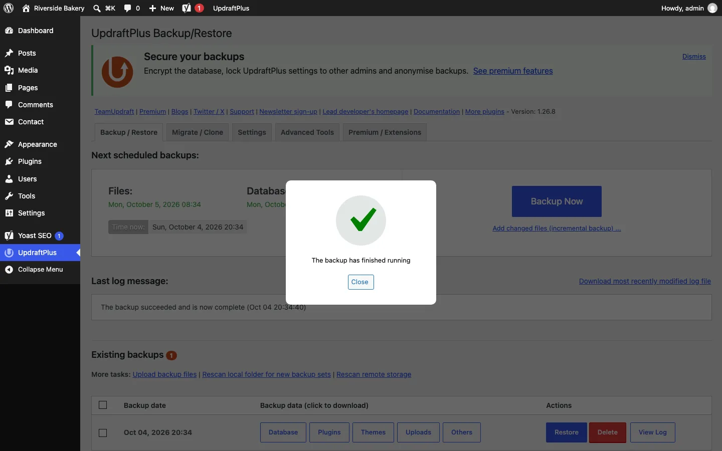 UpdraftPlus Backup/Restore screen with a “The backup has finished running” pop-up and one backup in the Existing backups list with Database, Plugins, Themes, Uploads and Others buttons